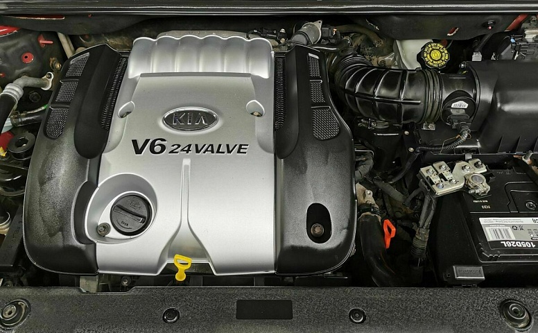 Kia Carnival 2.7 AT (186 л.с.) Красный