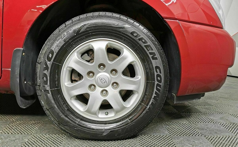 Kia Carnival 2.7 AT (186 л.с.) Красный